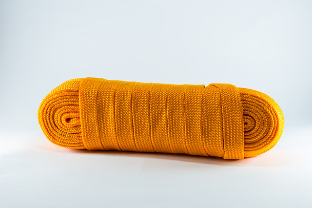 Rolos de corda laranja plana
 - Foto, Imagem