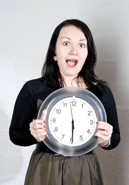 Woman showing on the clock - Photo, Image
