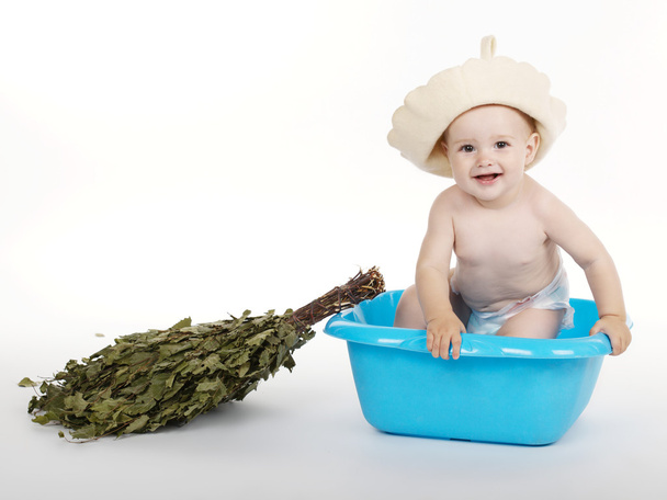 boy with bath hat and broom - Foto, Imagen