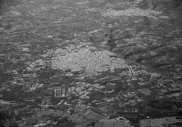 Italy, Sicily, aerial view of the sicilian countryside and Vittoria small town. Comiso in the background (Ragusa Province) - Photo, Image