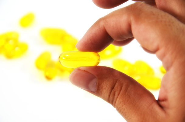 Fish oil in hand - Photo, Image