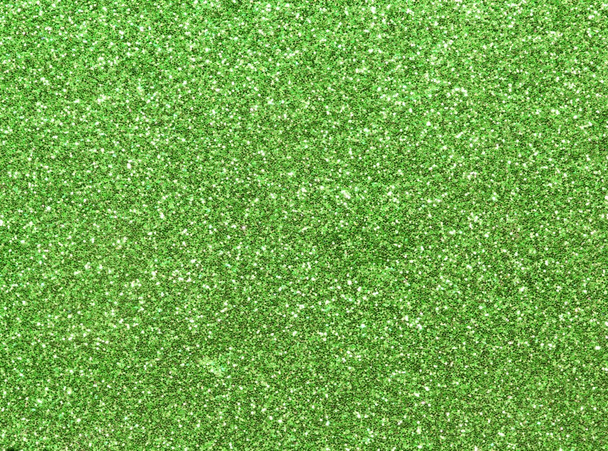 uniformly glitter green background and shimmering shiny texture - Photo, Image