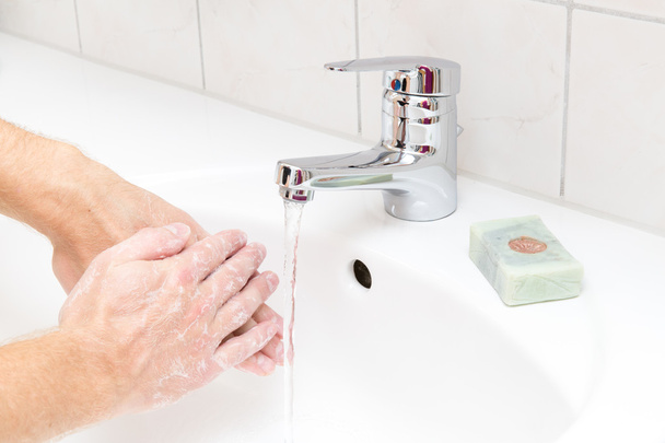 Man washing hands with soap - Photo, Image
