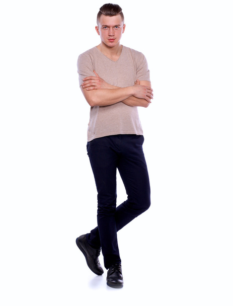 Portrait of a confident man standing over white background - Foto, Imagen