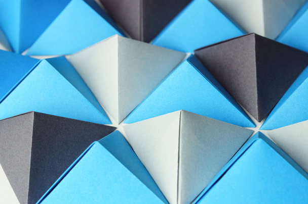 Origami blue and gray pyramids abstract background - Fotografie, Obrázek