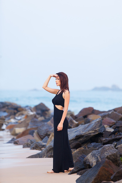 Young redhead woman in a black dress - Fotografie, Obrázek