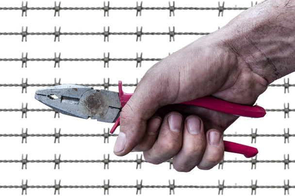 Dirty workman hand hold a pliers(pincer) barb wire background - Foto, Bild