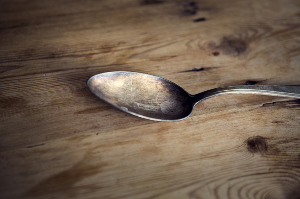 old spoon on wooden table - Foto, Imagen