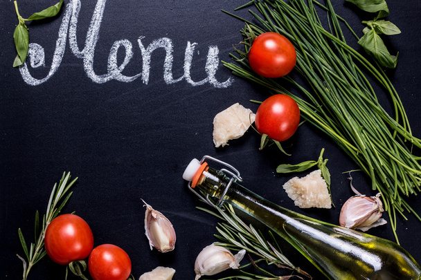 Set of ingredients on blackboard background with free space for text.  - Photo, image
