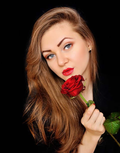 Beautiful woman with red rose on black background - Zdjęcie, obraz