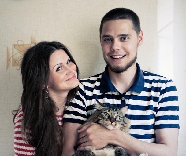 happy couple with cat - Фото, зображення