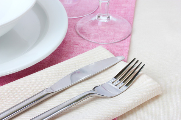Table setting with fork, knife, plates and napkin - Fotoğraf, Görsel
