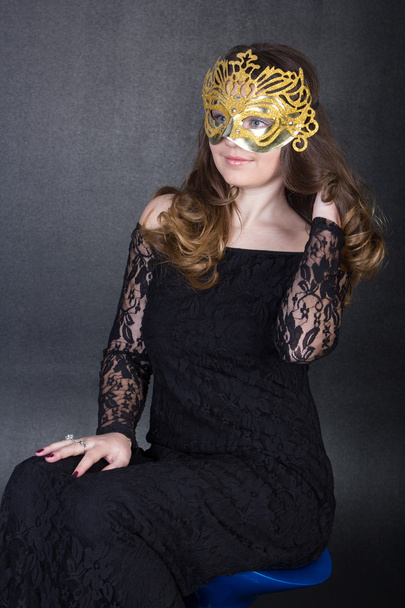 nice girl in mask and black dress - Fotó, kép