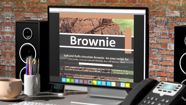 Monitor com receita Brownie na área de trabalho com objetos de escritório
. - Foto, Imagem
