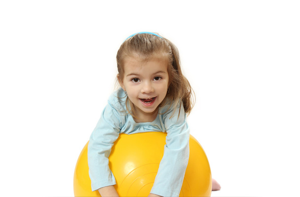 the nice little girl with a big ball - Фото, изображение