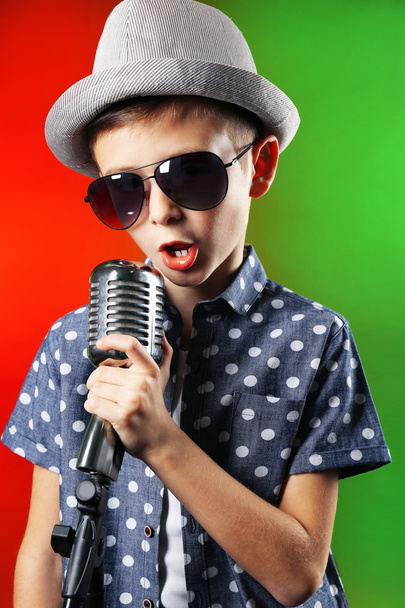Little boy singing with microphone  - Fotó, kép