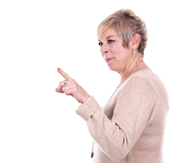 casual mature woman pointing - Фото, изображение