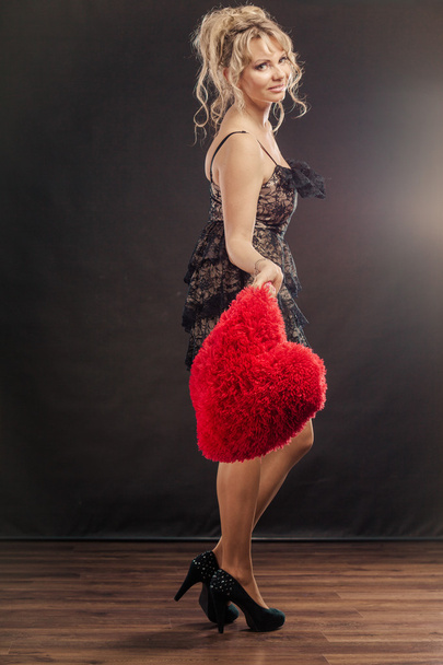 Mature woman holds big red heart  - Foto, immagini