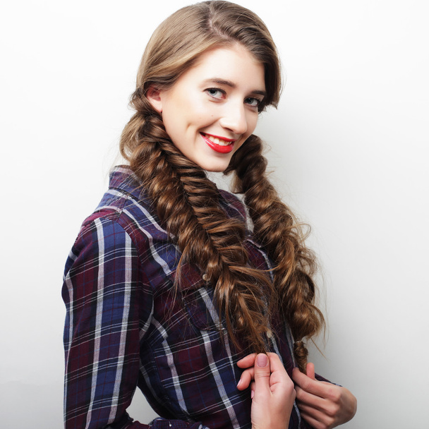 Portrait of a young lady with a braid - Photo, image