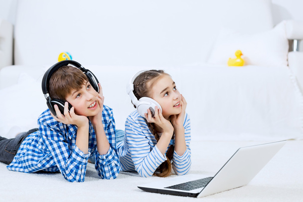 Cute kids using devices - Foto, afbeelding