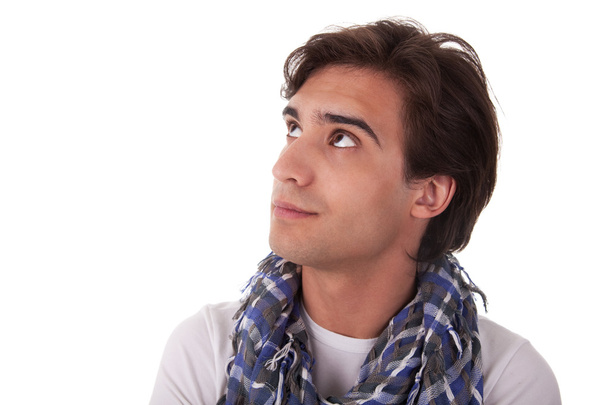 Портрет красивого молодого чоловіка, який дивиться на білому тлі. Студійний знімок
 - Фото, зображення