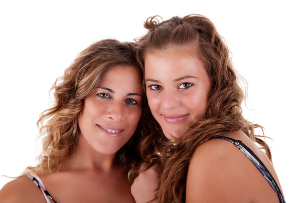 Happy mother and daughter embraced, isolated on white. Studio shot - Fotó, kép