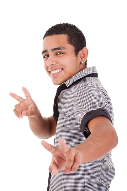 Young latin man with thumbs raised as a sign of victory, isolated on white background. studio shot - Фото, зображення