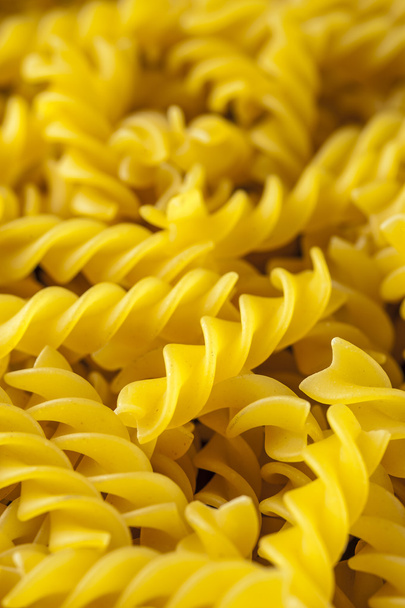 Fusilli pasta background, close up. Italian cuisine. - Fotoğraf, Görsel