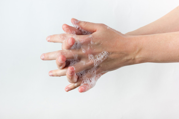 gesto de mulher lavar as mãos sobre fundo branco
 - Foto, Imagem