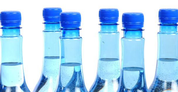 Close up of gas water bottles on a white background - Photo, Image