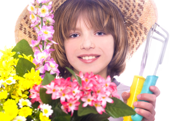 маленький мальчик с цветами - Фото, изображение