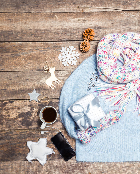 Winter clothes on wooden background. - Valokuva, kuva