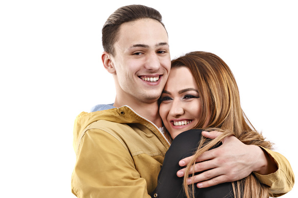Young man and woman together over white background - Foto, Bild