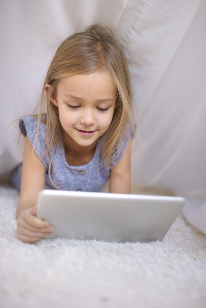 Girl using digital tablet - Фото, изображение