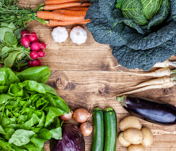 Fresh organic bio vegetables on wooden background - Фото, изображение