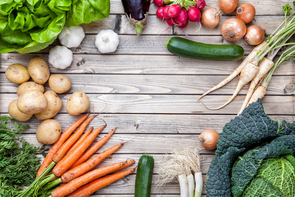 Fresh organic bio vegetables on wooden background - Photo, Image