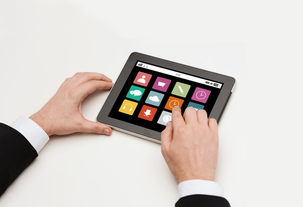 close up of man hands with app icons on tablet pc - Foto, immagini