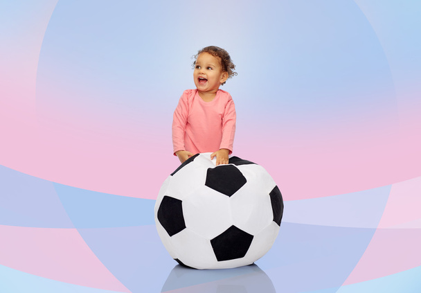 happy mulatto little baby girl playing with ball - Фото, изображение