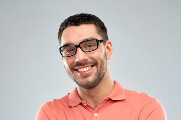 portrait of happy smiling man in eyeglasses - Фото, изображение