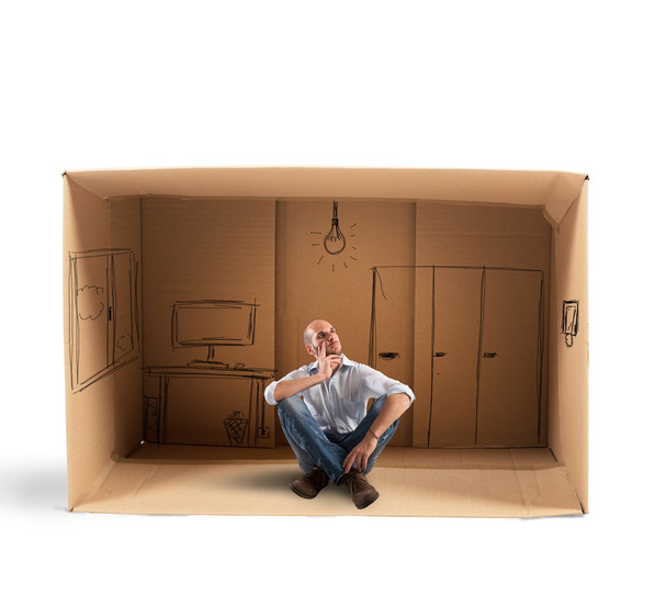 Businessman sitting in office designed in cardboard - Photo, Image