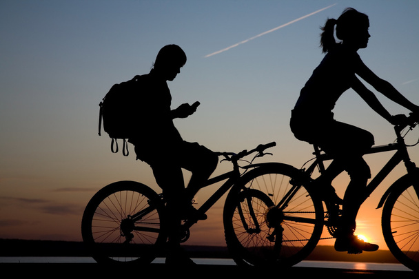 Couple bicycler on sunset - Foto, Bild