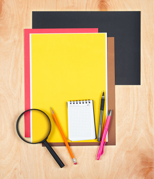 Flat lay office tools and supplies. Stationery on wood background. Flat design of workspace, workplace. Top view of desk background. - 写真・画像