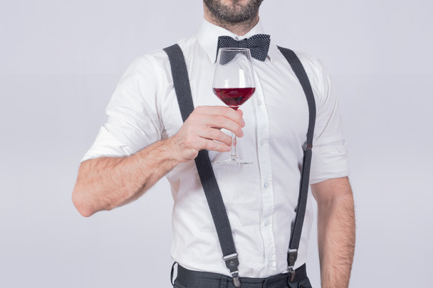Man with suspenders making a toast - Fotó, kép