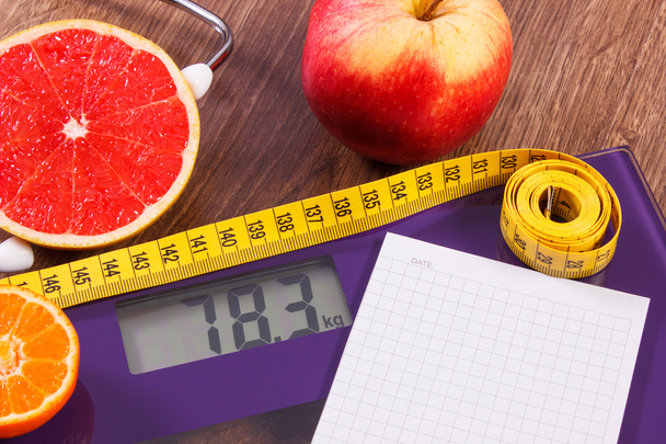 Electronic bathroom scale, centimeter and fresh fruits with stethoscope, slimming and healthy lifestyles - Φωτογραφία, εικόνα