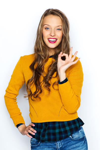щаслива молода жінка або підліток, показуючи знак гарячої руки
 - Фото, зображення