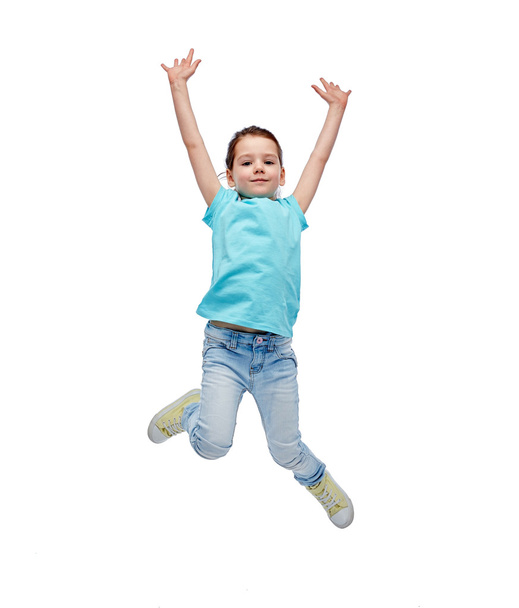 happy little girl jumping in air - Фото, зображення