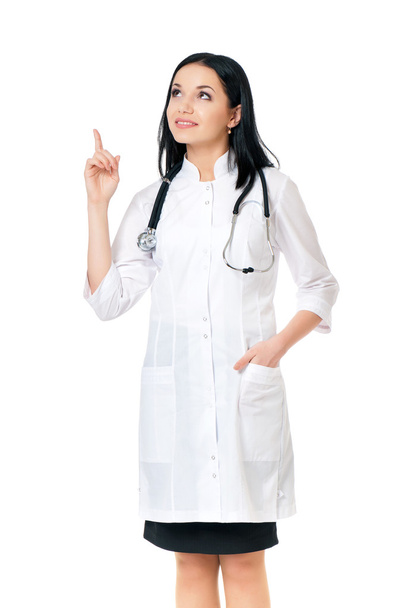 Smiling medical doctor woman with stethoscope showing something - Photo, Image
