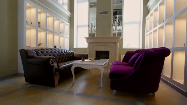 Living room with large window fireplace and sofas. - Footage, Video