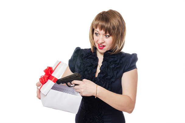 The girl holds a box with a gift in hand - Foto, Imagen