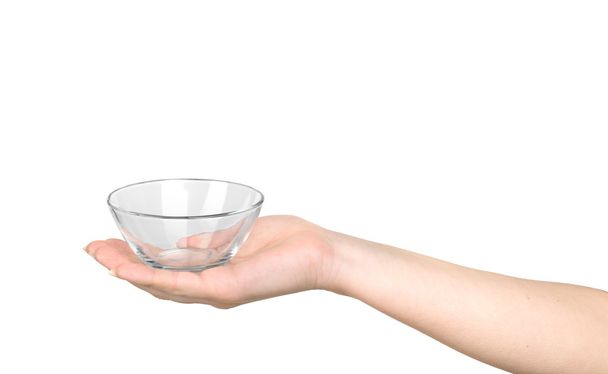 Hand holding an empty bowl on a white background - Photo, Image